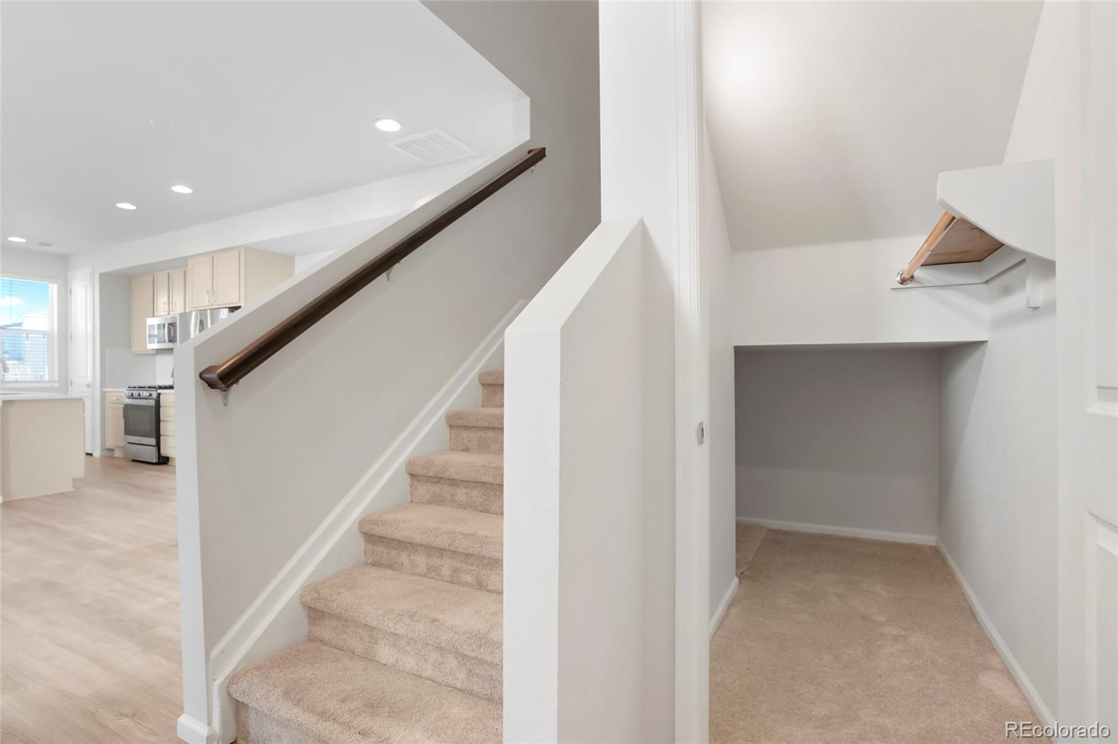 1675 South Andes Way Aurora, CO 80017 - Photo 19 of 32 a view of entryway and hall with wooden floor