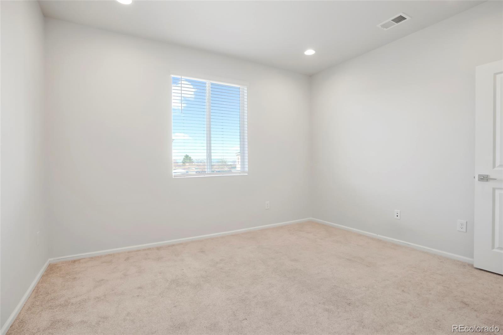 1675 South Andes Way Aurora, CO 80017 - Photo 28 of 32 an empty room with a window