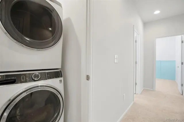 a view of a hallway with washer and dryer