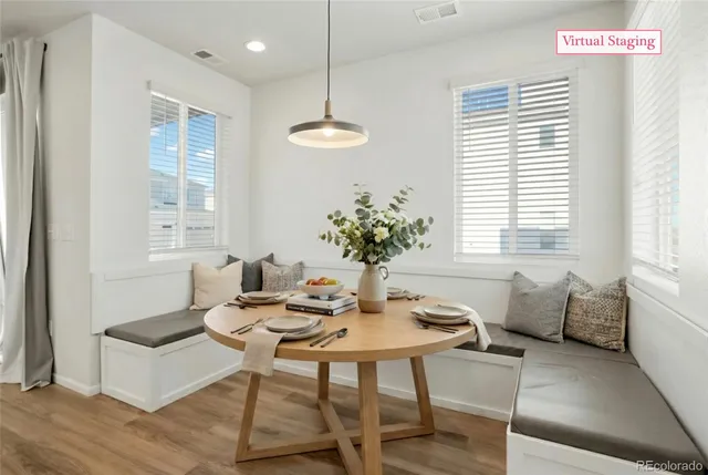 a dining room with furniture and window