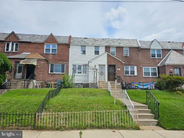 8509 Temple Road Philadelphia, PA 19150 - Photo 1 of 16 front view of a house with a yard