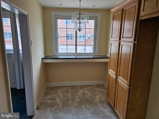 8509 Temple Road Philadelphia, PA 19150 - Photo 7 of 16 a view of kitchen with window and refrigerator