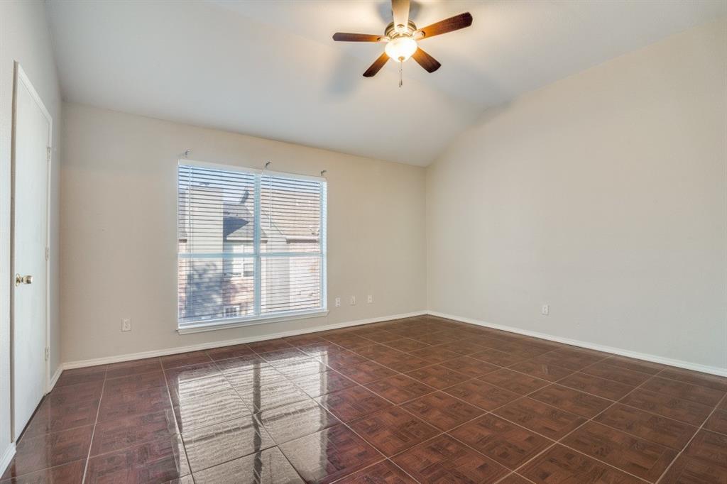 3817 Brandon Park Drive Garland, TX 75044 - Photo 8 of 11 an empty room with windows and fan