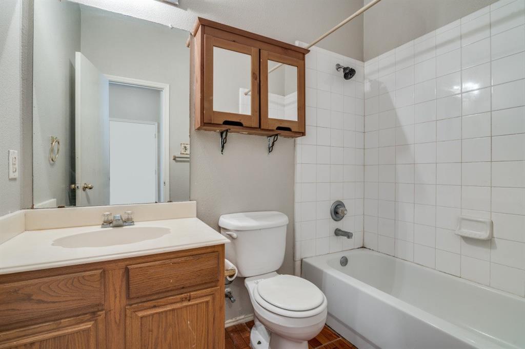 3817 Brandon Park Drive Garland, TX 75044 - Photo 9 of 11 a bathroom with a sink toilet and shower