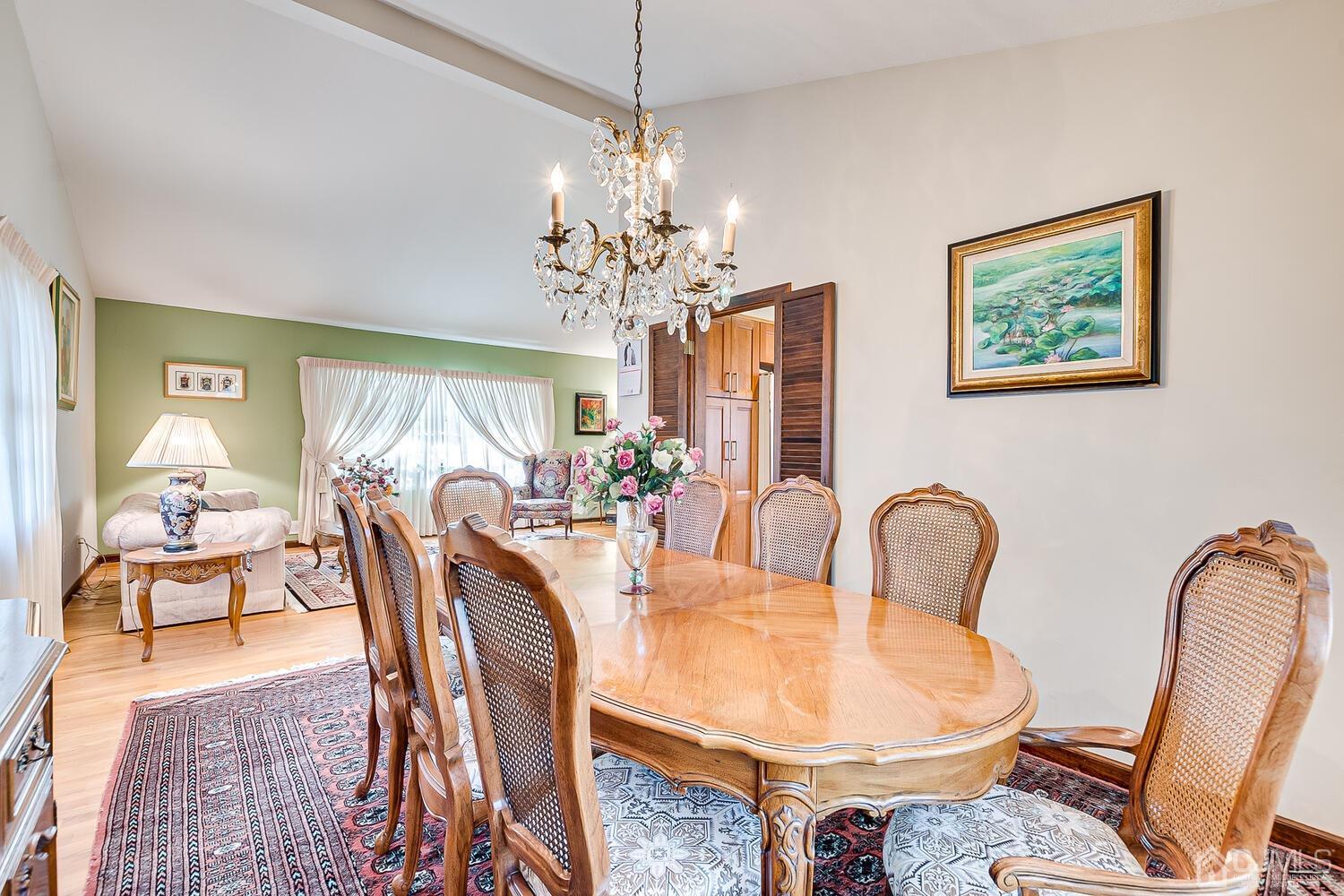 41 Clive Hills Road Edison, NJ 08820 - Photo 12 of 39 a dining room with furniture a livingroom view and wooden floor