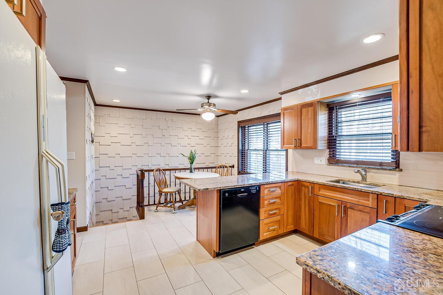 41 Clive Hills Road Edison, NJ 08820 - Photo 13 of 39 a kitchen with a sink a counter top space and stainless steel appliances