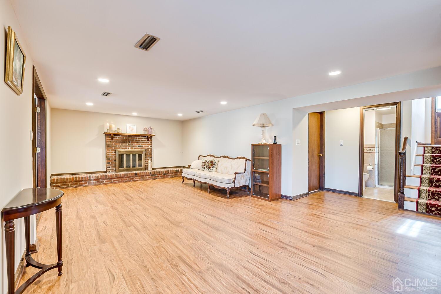41 Clive Hills Road Edison, NJ 08820 - Photo 20 of 39 a spacious bedroom with a bed a table and a large window