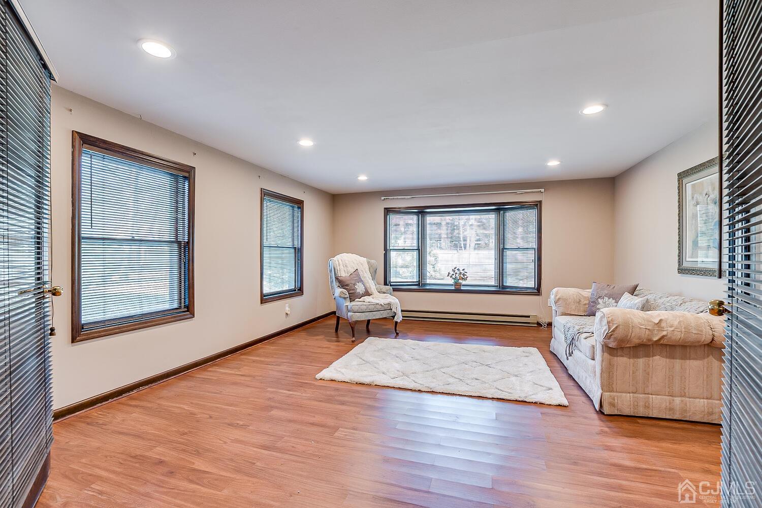 41 Clive Hills Road Edison, NJ 08820 - Photo 22 of 39 a living room with furniture and a window