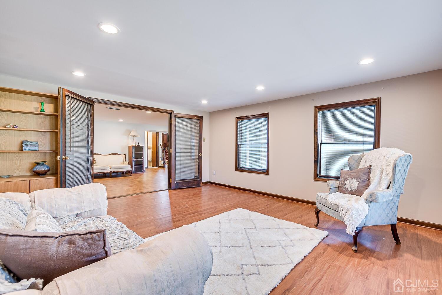 41 Clive Hills Road Edison, NJ 08820 - Photo 23 of 39 a living room with furniture and a table