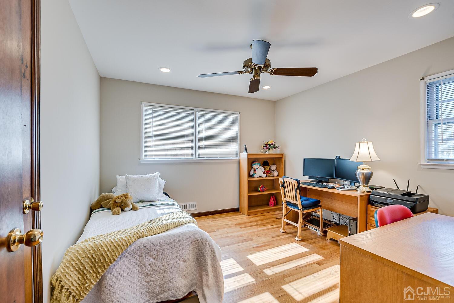 41 Clive Hills Road Edison, NJ 08820 - Photo 31 of 39 a bedroom with a bed a desk and chair