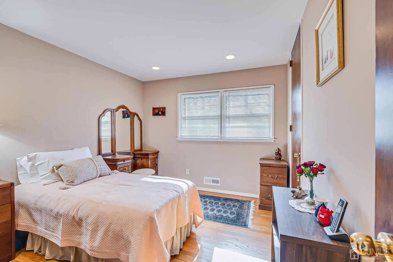 41 Clive Hills Road Edison, NJ 08820 - Photo 32 of 39 a bedroom with a bed and a window