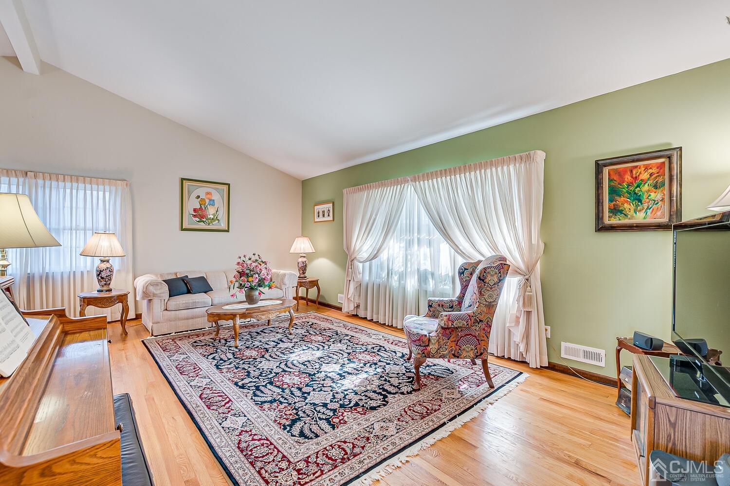 41 Clive Hills Road Edison, NJ 08820 - Photo 7 of 39 a living room with furniture and a rug