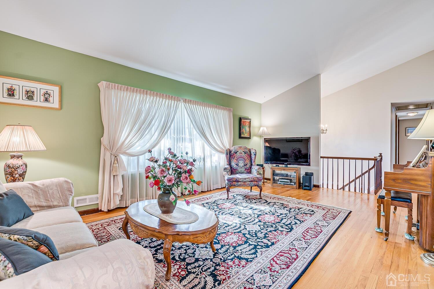 41 Clive Hills Road Edison, NJ 08820 - Photo 8 of 39 a living room with furniture and a wooden floor