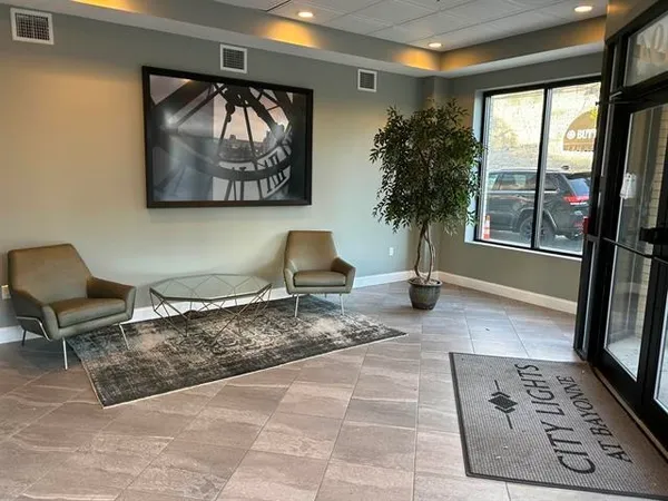 a living room with furniture and a window