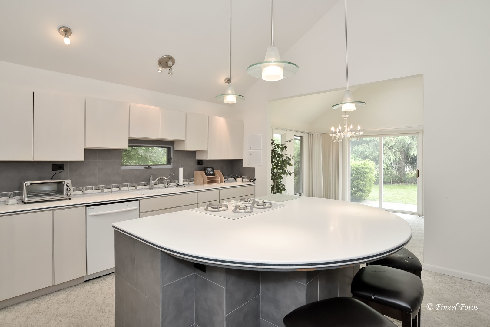 1817 Orchard Lane McHenry, IL 60050 - Photo 6 of 20 a kitchen with stainless steel appliances a table and chairs in it