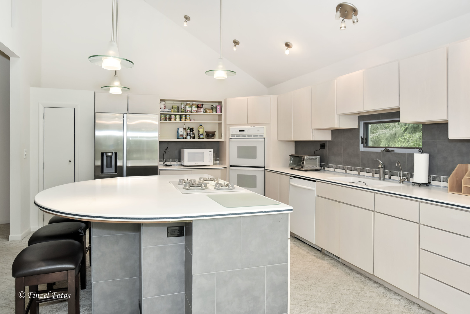 1817 Orchard Lane McHenry, IL 60050 - Photo 7 of 20 a kitchen with a sink a stove a refrigerator and white cabinets