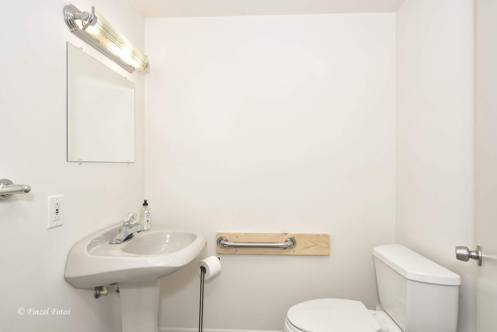 1817 Orchard Lane McHenry, IL 60050 - Photo 10 of 20 a bathroom with a toilet sink and mirror