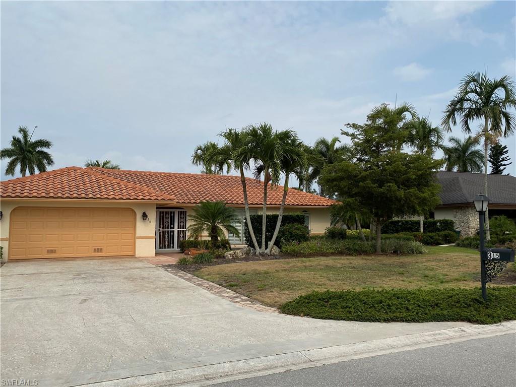 315 Torrey Pines Point Naples, FL 34113 - Photo 8 of 8 a house view with a garden space