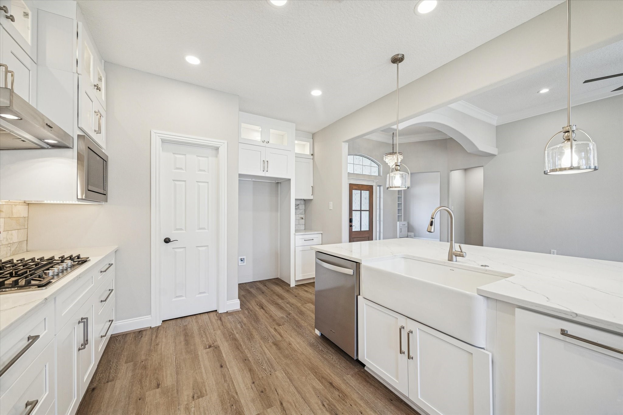 5437 Edgewater Court Willis, TX 77318 - Photo 12 of 29 a kitchen with a sink stove and cabinets