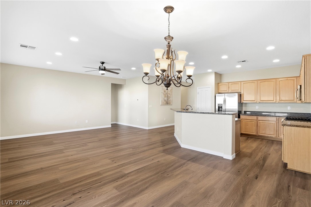 2541 Darda Street Henderson, NV 89044 - Photo 5 of 26 Bright open-concept living space features durable flooring and a well-appointed kitchen for daily life.