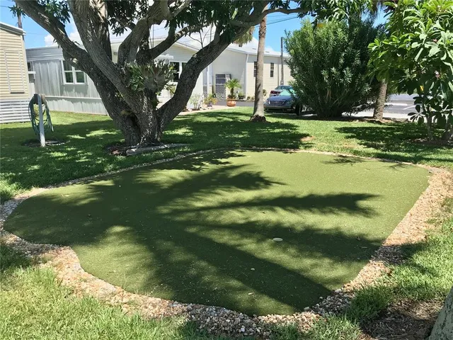 a view of a big yard with a house