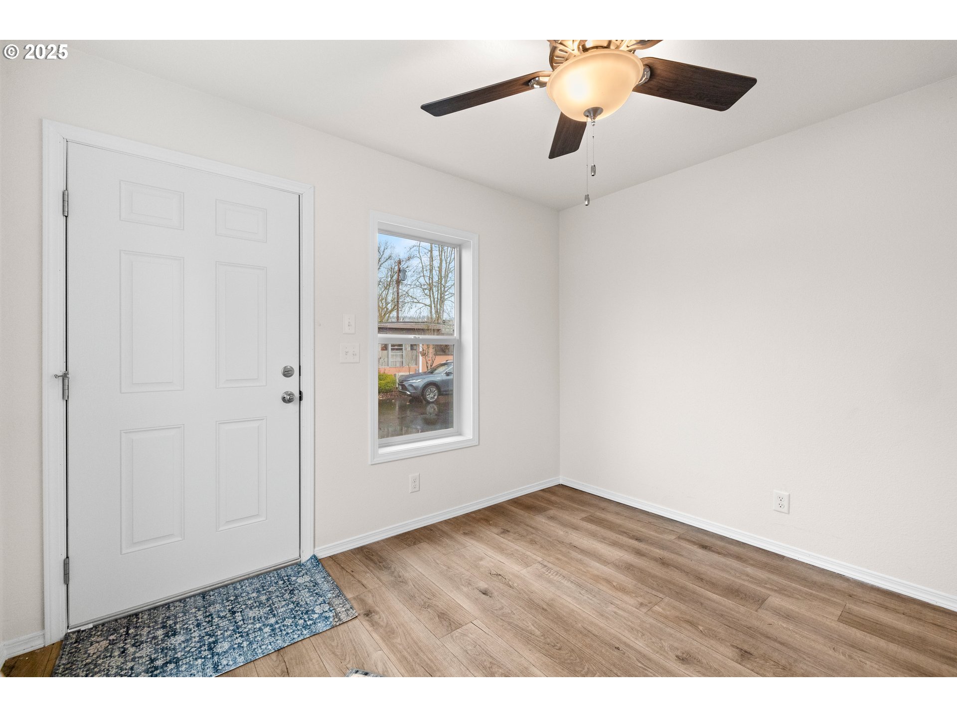 19605 River Road, Unit 88 Gladstone, OR 97027 - Photo 14 of 25 a view of an empty room with a window