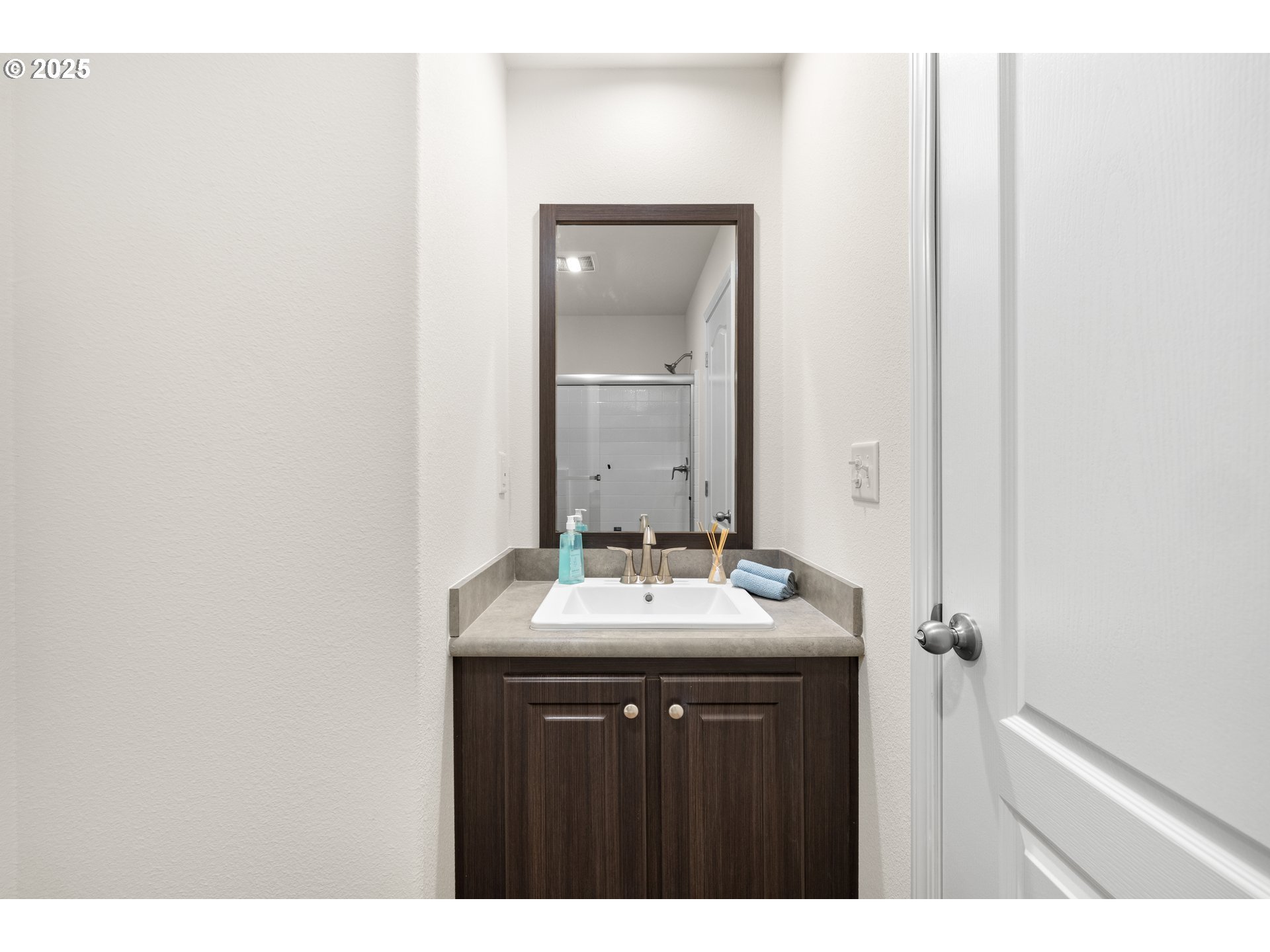 19605 River Road, Unit 88 Gladstone, OR 97027 - Photo 19 of 25 a bathroom with a sink vanity and mirror
