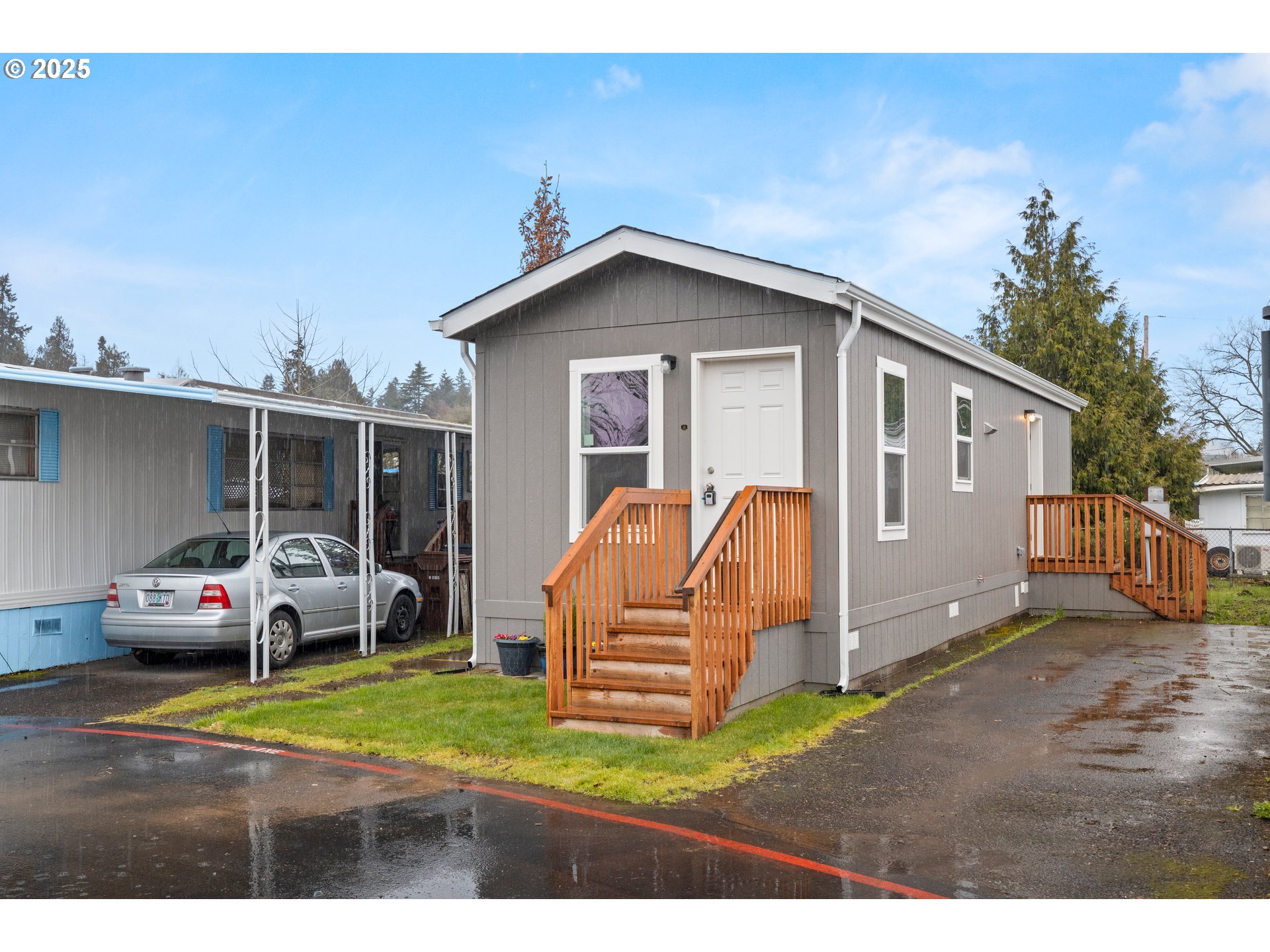 19605 River Road, Unit 88 Gladstone, OR 97027 - Photo 2 of 25 a front view of a house with a yard