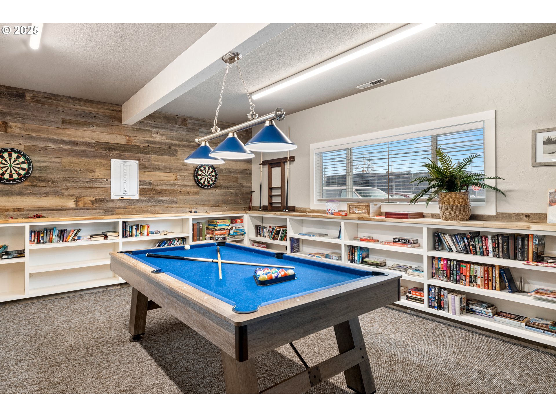 19605 River Road, Unit 88 Gladstone, OR 97027 - Photo 24 of 25 a living room with furniture a table and bookshelf