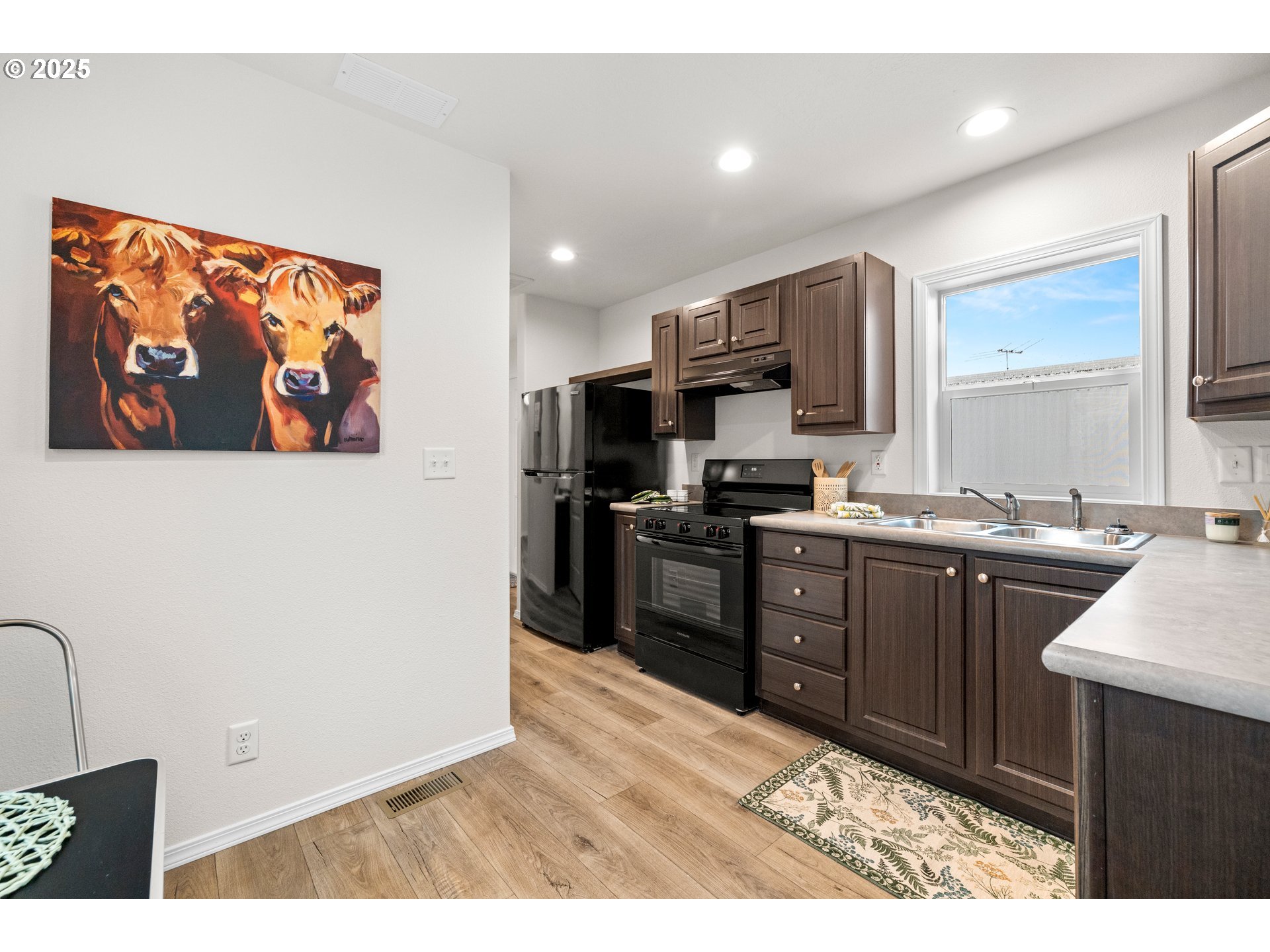 19605 River Road, Unit 88 Gladstone, OR 97027 - Photo 6 of 25 a kitchen with stainless steel appliances granite countertop a refrigerator and a stove top oven