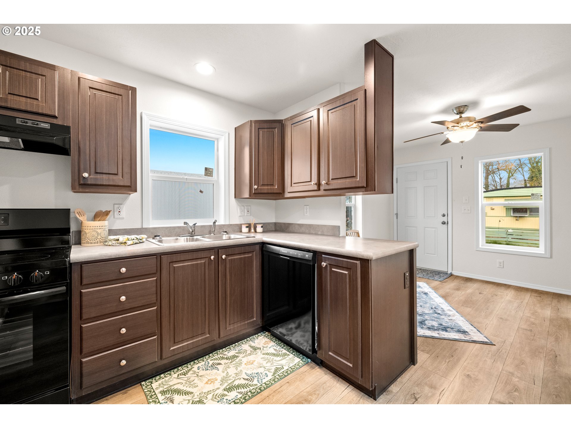 19605 River Road, Unit 88 Gladstone, OR 97027 - Photo 8 of 25 a kitchen with stainless steel appliances granite countertop a sink stove and cabinets