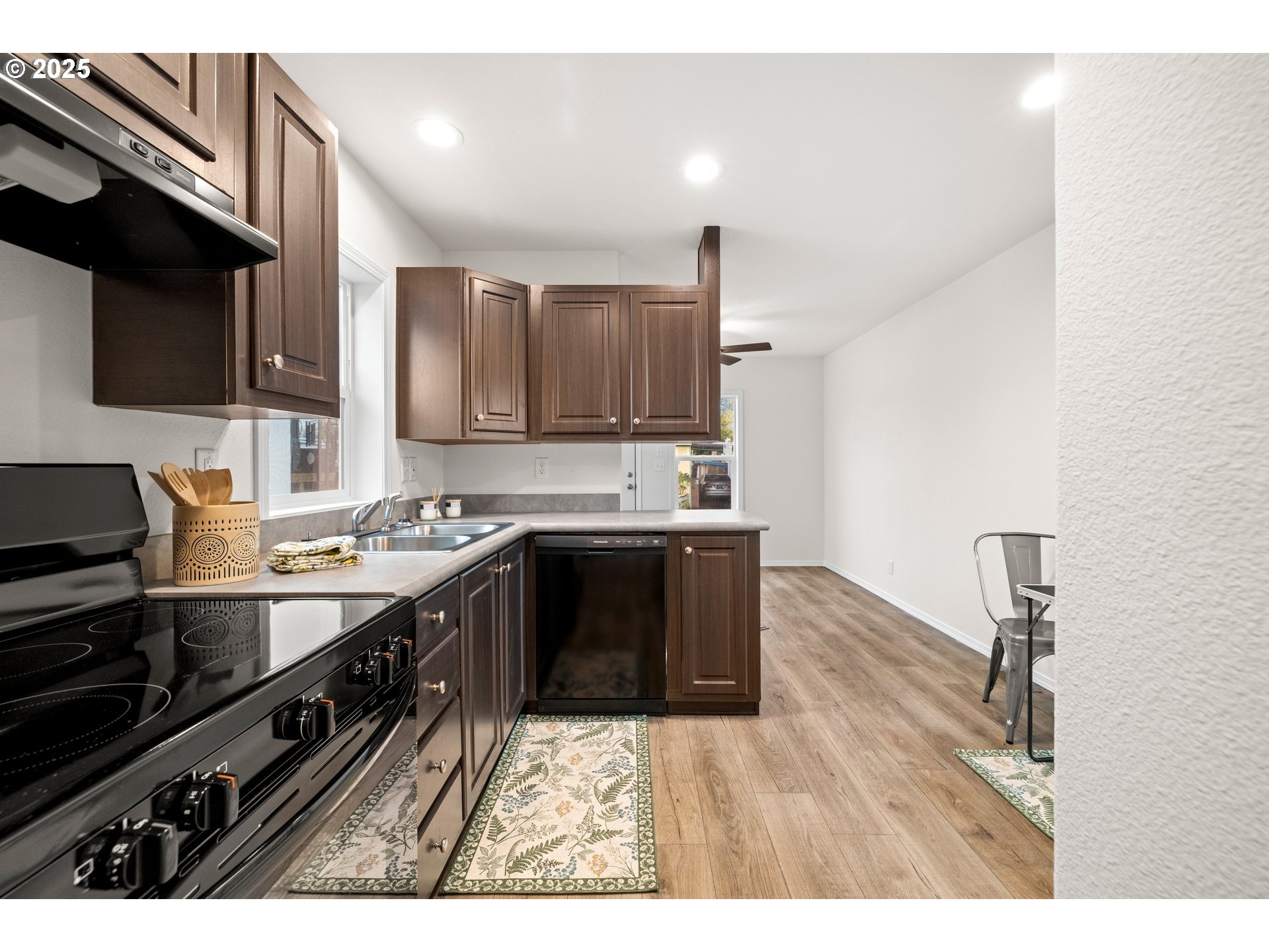 19605 River Road, Unit 88 Gladstone, OR 97027 - Photo 10 of 25 a kitchen with stainless steel appliances a sink stove and cabinets