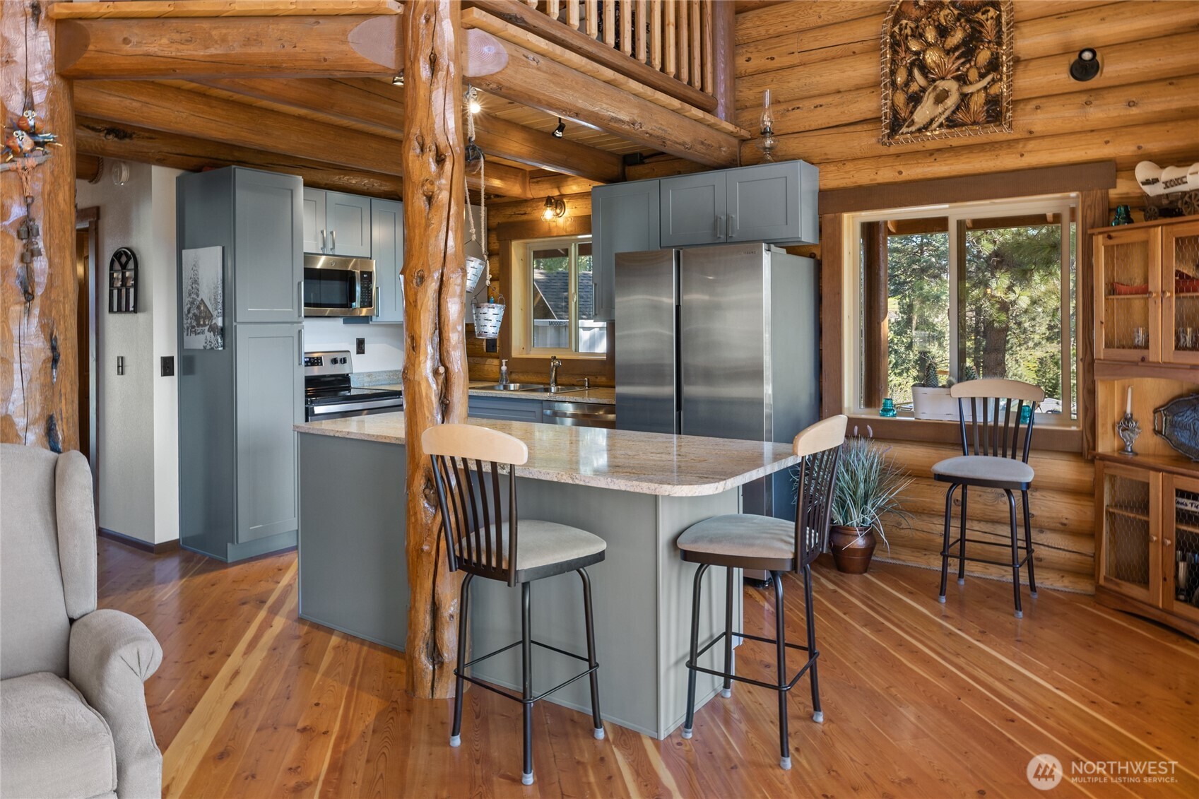 351 Ridge Loop Road Cle Elum, WA 98922 - Photo 12 of 38 a dining room with furniture and wooden floor