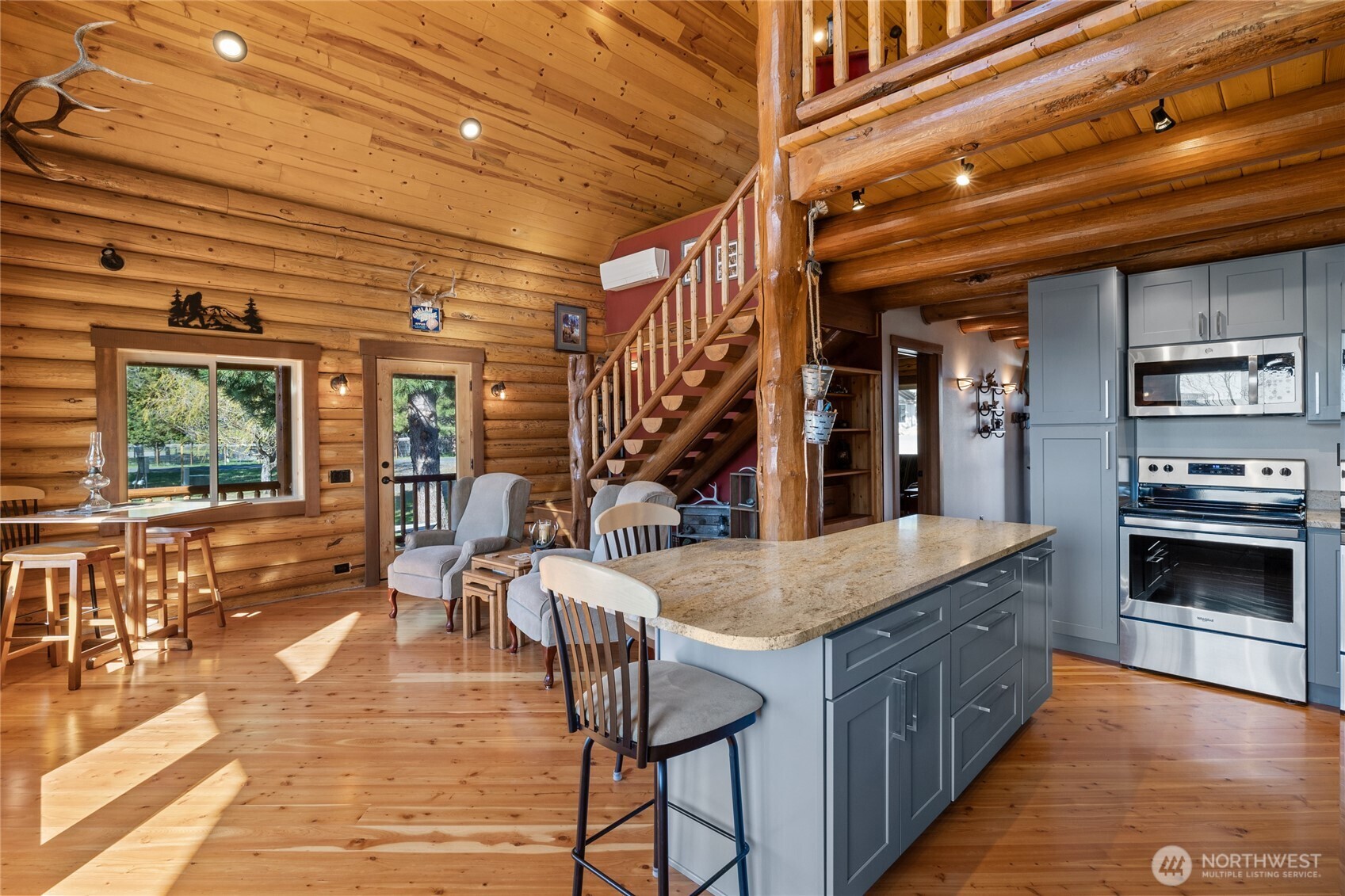 351 Ridge Loop Road Cle Elum, WA 98922 - Photo 13 of 38 a dining hall with stainless steel appliances granite countertop a stove and cabinets with wooden floor