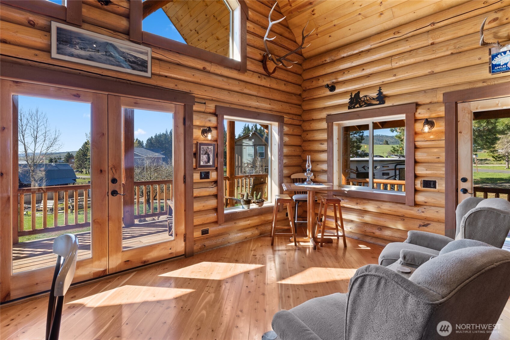 351 Ridge Loop Road Cle Elum, WA 98922 - Photo 18 of 38 a living room with furniture a floor to ceiling window and wooden floor