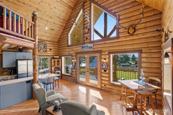 a view of a chairs and a table in the patio