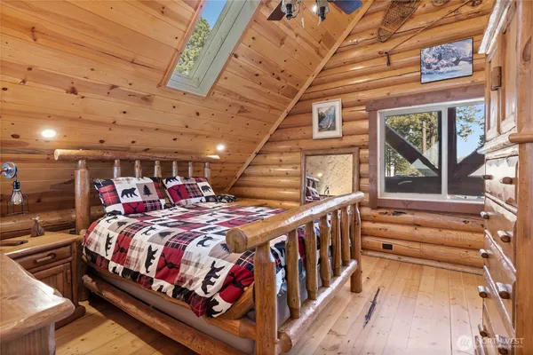 a bed room with two beds and a chandelier