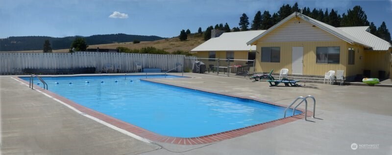 351 Ridge Loop Road Cle Elum, WA 98922 - Photo 36 of 38 a view of a house with swimming pool and sitting area