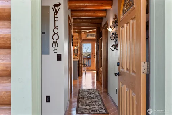 a view of a hallway with a wooden door