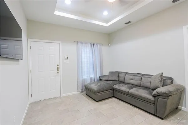 a kitchen with a dining table chairs and cabinets