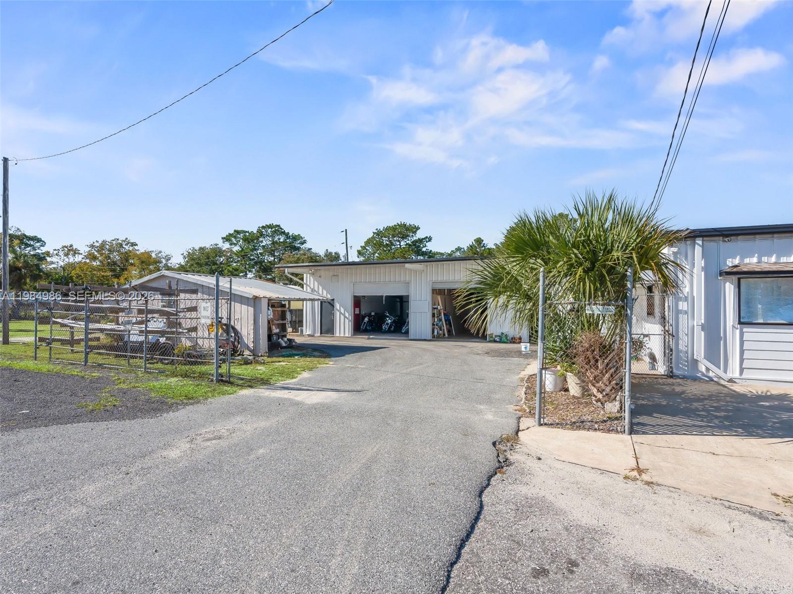 9594 Southeast Maricamp Road Ocala, FL 34472 - Photo 18 of 45 a house view with a backyard space