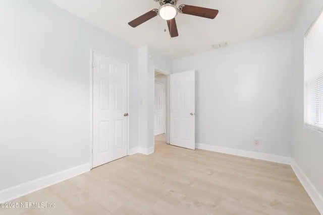 an empty room with fan