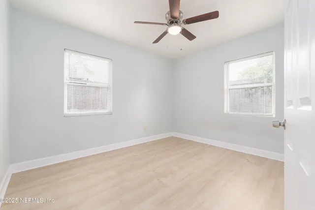a view of an empty room with a window