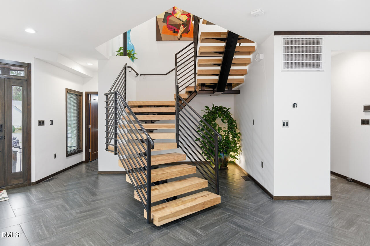 3315 Denada Path Durham, NC 27707 - Photo 5 of 74 a view of entryway with stairs and wooden floor