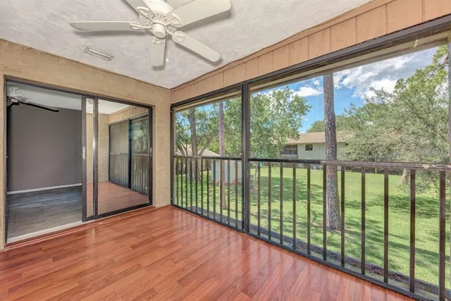 a view of a porch with wooden floor and outdoor space