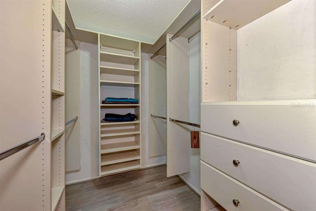 5645 Summerside Lane, Unit 40B Sarasota, FL 34231 - Photo 16 of 23 a view of walk in closet with empty racks