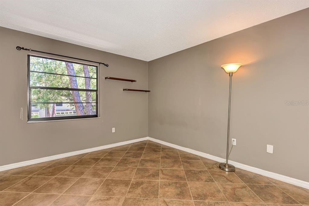 5645 Summerside Lane, Unit 40B Sarasota, FL 34231 - Photo 17 of 23 a view of an empty room with a window