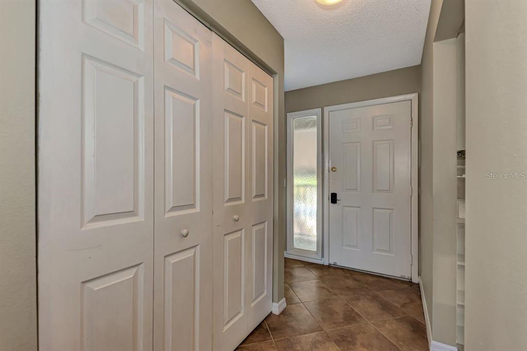 5645 Summerside Lane, Unit 40B Sarasota, FL 34231 - Photo 19 of 23 a view of a hallway with wooden floor