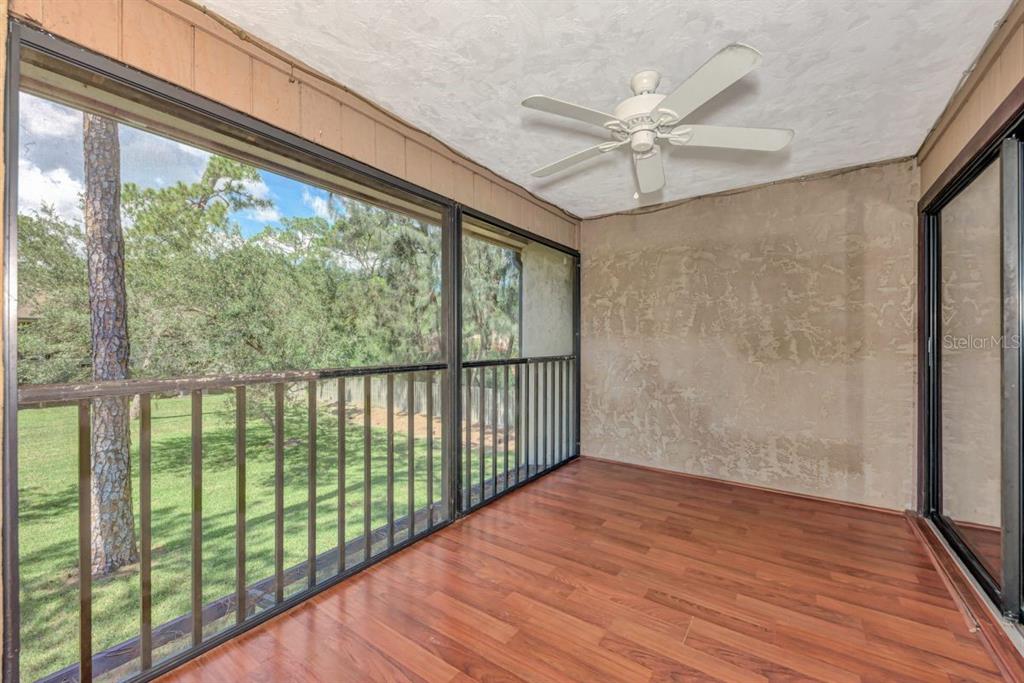 5645 Summerside Lane, Unit 40B Sarasota, FL 34231 - Photo 2 of 23 a view of a hallway with wooden floor