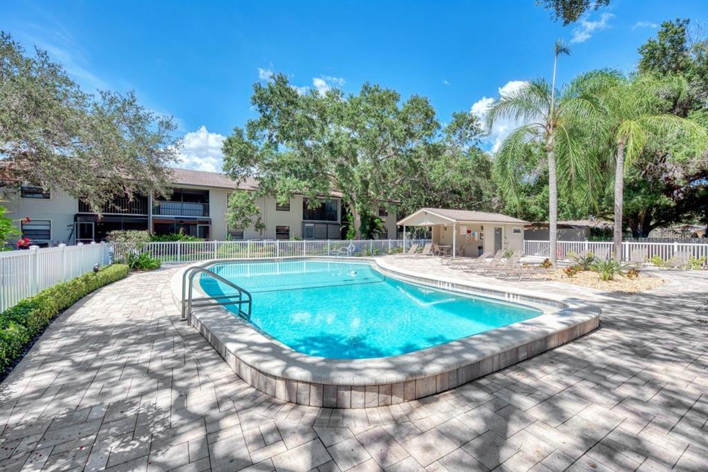 5645 Summerside Lane, Unit 40B Sarasota, FL 34231 - Photo 3 of 23 a view of a swimming pool with a patio